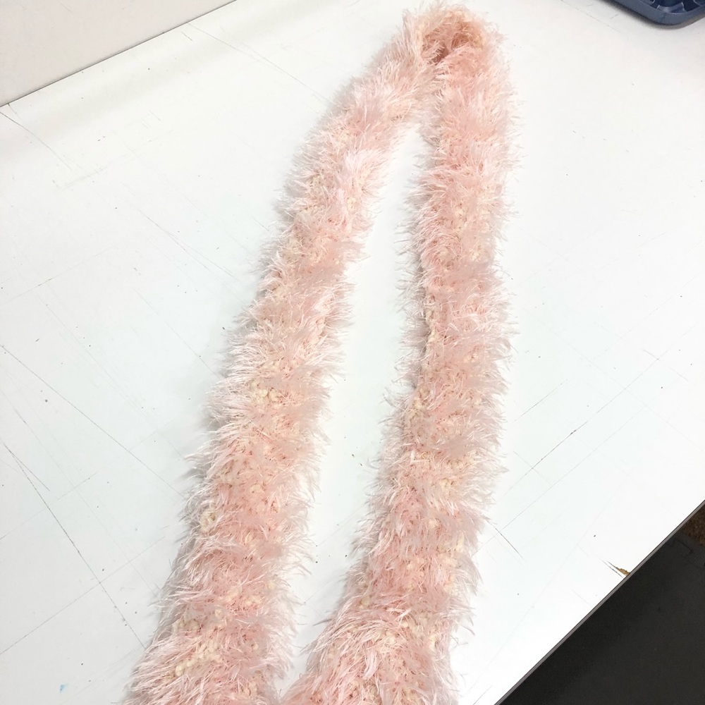 Pink hand knitted scarf